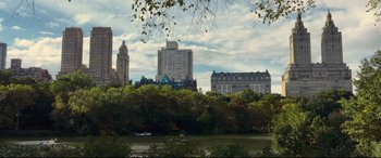 Movie still from “A Dog's Journey” (2019), directed by Gail Mancuso – A view of a city skyline from across a river; Extreme Wide shot, High angle