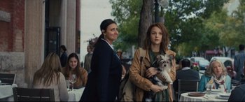 Movie still from “A Dog's Journey” (2019), directed by Gail Mancuso – Two women standing next to each other on a sidewalk; Medium shot, Over the shoulder angle