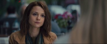 Movie still from “A Dog's Journey” (2019), directed by Gail Mancuso – A young woman with long brown hair looking at the camera; Close Up shot, Over the shoulder angle