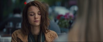 Movie still from “A Dog's Journey” (2019), directed by Gail Mancuso – A woman with her eyes closed sitting in a chair; Close Up shot, Over the shoulder angle