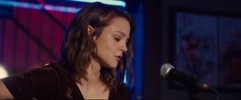 Movie still from “A Dog's Journey” (2019), directed by Gail Mancuso – A person with a microphone; Close Up shot, Over the shoulder angle