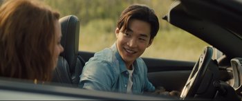 Movie still from “A Dog's Journey” (2019), directed by Gail Mancuso – A man sitting in the passenger seat of a car; Close Up shot, Over the shoulder angle