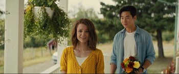 Movie still from “A Dog's Journey” (2019), directed by Gail Mancuso – A woman in a yellow polka dot shirt and a man in a blue shirt; Medium shot, Over the shoulder angle