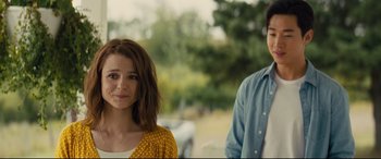 Movie still from “A Dog's Journey” (2019), directed by Gail Mancuso – A woman standing next to a man in a park; Close Up shot, Over the shoulder angle