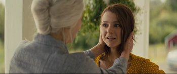 Movie still from “A Dog's Journey” (2019), directed by Gail Mancuso – A young woman looking in the reflection of herself in a mirror; Close Up shot, Over the shoulder angle