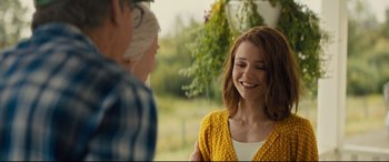 Movie still from “A Dog's Journey” (2019), directed by Gail Mancuso – A woman in a yellow sweater talking to a man; Medium shot, Over the shoulder angle