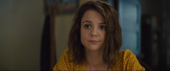 Movie still from “A Dog's Journey” (2019), directed by Gail Mancuso – A young woman with brown hair wearing a polka dot shirt; Close Up shot, Over the shoulder angle
