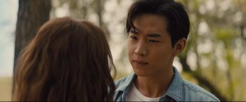 Movie still from “A Dog's Journey” (2019), directed by Gail Mancuso – A young man is talking to a young woman outside; Close Up shot, Over the shoulder angle