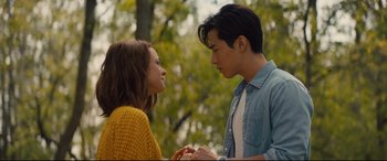 Movie still from “A Dog's Journey” (2019), directed by Gail Mancuso – A man and a woman standing next to each other in a park; Close Up shot, Over the shoulder angle