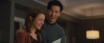 Movie still from “A Dog's Journey” (2019), directed by Gail Mancuso – A man and a woman smiling for the camera; Medium shot, Over the shoulder angle