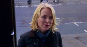 Movie still from “Eastern Promises” (2007), directed by David Cronenberg – A woman with blonde hair wearing a black jacket; Close Up shot, Over the shoulder angle