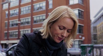 Movie still from “Eastern Promises” (2007), directed by David Cronenberg – A woman with blonde hair wearing a black jacket; Close Up shot, Over the shoulder angle