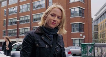 Movie still from “Eastern Promises” (2007), directed by David Cronenberg – A woman with blonde hair wearing a black jacket; Close Up shot, Over the shoulder angle