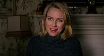 Movie still from “Eastern Promises” (2007), directed by David Cronenberg – A person wearing a sweater; Close Up shot, Over the shoulder angle