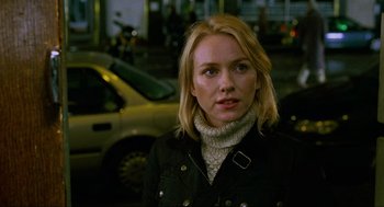 Movie still from “Eastern Promises” (2007), directed by David Cronenberg – A woman with blonde hair wearing a black jacket; Close Up shot, Over the shoulder angle