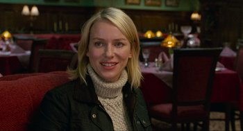 Movie still from “Eastern Promises” (2007), directed by David Cronenberg – A woman sitting at a table in a restaurant; Close Up shot, Over the shoulder angle