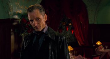 Movie still from “Eastern Promises” (2007), directed by David Cronenberg – A person wearing a leather jacket; Close Up shot, Over the shoulder angle