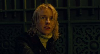 Movie still from “Eastern Promises” (2007), directed by David Cronenberg – A young woman with blonde hair and a sweater on; Close Up shot, Low angle