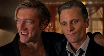 Movie still from “Eastern Promises” (2007), directed by David Cronenberg – A couple of men sitting next to each other; Close Up shot, Over the shoulder angle