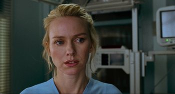 Movie still from “Eastern Promises” (2007), directed by David Cronenberg – A person wearing a blue shirt; Close Up shot, Over the shoulder angle