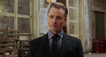 Movie still from “Eastern Promises” (2007), directed by David Cronenberg – A person wearing a suit and tie; Close Up shot, Over the shoulder angle
