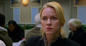 Movie still from “Eastern Promises” (2007), directed by David Cronenberg – A woman with blonde hair and a black jacket; Close Up shot, Over the shoulder angle