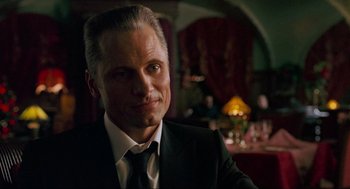 Movie still from “Eastern Promises” (2007), directed by David Cronenberg – A person wearing a suit and tie; Close Up shot, Over the shoulder angle