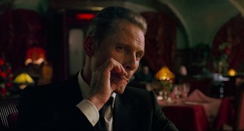 Movie still from “Eastern Promises” (2007), directed by David Cronenberg – A person wearing a suit and tie; Close Up shot, Over the shoulder angle