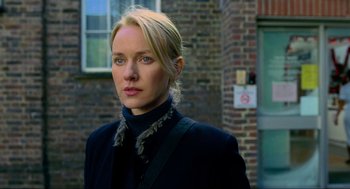 Movie still from “Eastern Promises” (2007), directed by David Cronenberg – A woman with blonde hair wearing a black jacket; Close Up shot, Over the shoulder angle