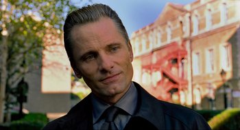 Movie still from “Eastern Promises” (2007), directed by David Cronenberg – A person wearing a suit and tie; Close Up shot, Low angle
