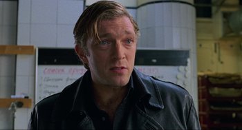 Movie still from “Eastern Promises” (2007), directed by David Cronenberg – A person with long hair; Close Up shot, Low angle