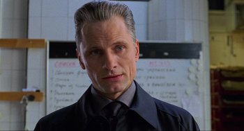 Movie still from “Eastern Promises” (2007), directed by David Cronenberg – A person wearing a suit and tie; Close Up shot, Low angle