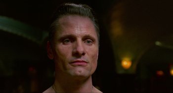 Movie still from “Eastern Promises” (2007), directed by David Cronenberg – A person wearing a necklace; Close Up shot, Low angle
