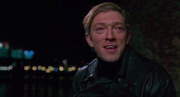 Movie still from “Eastern Promises” (2007), directed by David Cronenberg – A person wearing a black jacket; Close Up shot, Over the shoulder angle