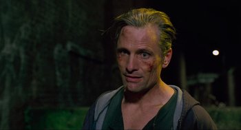 Movie still from “Eastern Promises” (2007), directed by David Cronenberg – A person with a bruise on his face; Close Up shot, Over the shoulder angle