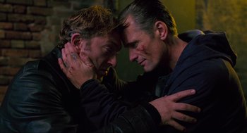 Movie still from “Eastern Promises” (2007), directed by David Cronenberg – A couple of people that are hugging each other; Close Up shot, Low angle