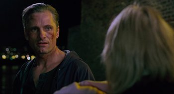 Movie still from “Eastern Promises” (2007), directed by David Cronenberg – A man with bruises on his face looking into a mirror; Close Up shot, Over the shoulder angle