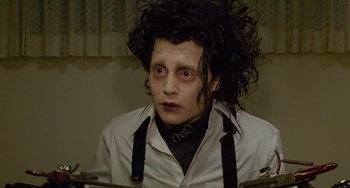 Movie still from “Edward Scissorhands” (1990), directed by Tim Burton – A person wearing a shirt and tie; Close Up shot, Low angle