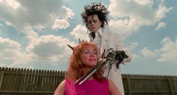 Movie still from “Edward Scissorhands” (1990), directed by Tim Burton – A woman is getting her hair cut by a man in a white lab coat; Medium shot, Low angle