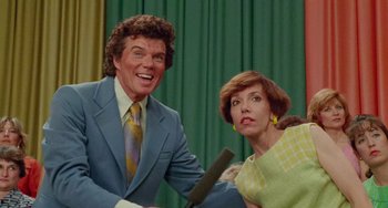 Movie still from “Edward Scissorhands” (1990), directed by Tim Burton – A man and a woman are holding a knife; Medium shot, Low angle