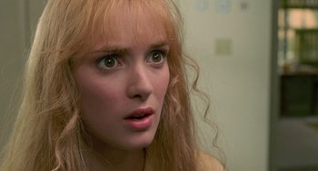 Movie still from “Edward Scissorhands” (1990), directed by Tim Burton – A woman's eyes and face; Close Up shot, Over the shoulder angle