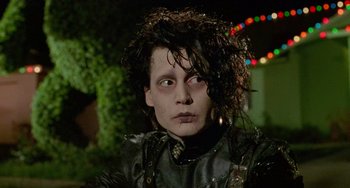 Movie still from “Edward Scissorhands” (1990), directed by Tim Burton – A person wearing a leather jacket; Close Up shot, Low angle