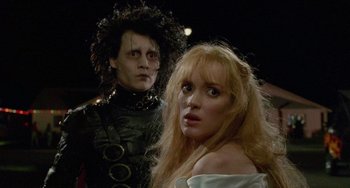Movie still from “Edward Scissorhands” (1990), directed by Tim Burton – A woman and a man dressed as edward scissorhands; Close Up shot, Over the shoulder angle