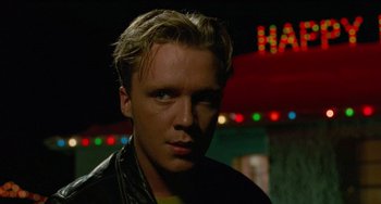 Movie still from “Edward Scissorhands” (1990), directed by Tim Burton – A person wearing a leather jacket; Close Up shot, Low angle