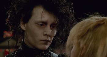 Movie still from “Edward Scissorhands” (1990), directed by Tim Burton – Johnny depp as edward scissorhands in a scene from the movie; Close Up shot, Over the shoulder angle
