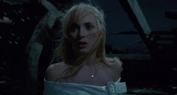 Movie still from “Edward Scissorhands” (1990), directed by Tim Burton – A woman with blonde hair wearing a white dress; Close Up shot, Low angle