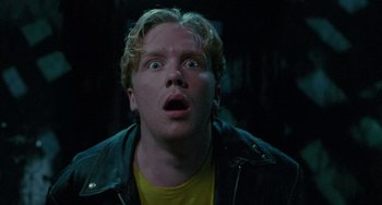 Movie still from “Edward Scissorhands” (1990), directed by Tim Burton – A man with a surprised look on his face; Close Up shot, Low angle