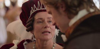 Movie still from “Ehrengard: The Art of Seduction” (2023), directed by Bille August – A person wearing a crown; Close Up shot, Over the shoulder angle