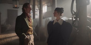 Movie still from “Ehrengard: The Art of Seduction” (2023), directed by Bille August – A man and a woman standing next to each other; Medium shot, Over the shoulder angle