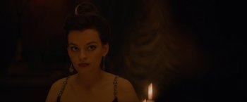 Movie still from “Eiffel” (2021), directed by Martin Bourboulon – A beautiful woman sitting in front of a lit candle; Close Up shot, Over the shoulder angle